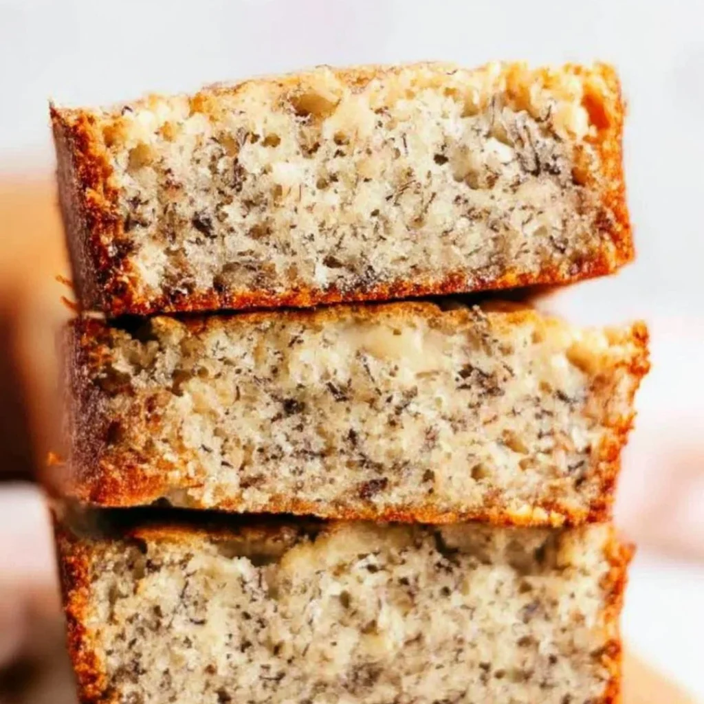 Blue_Salt_Trick_for_Men_Recipe_05 A bright, fizzy blue beverage with granulated salt crystals and a clear jar on a granite surface.