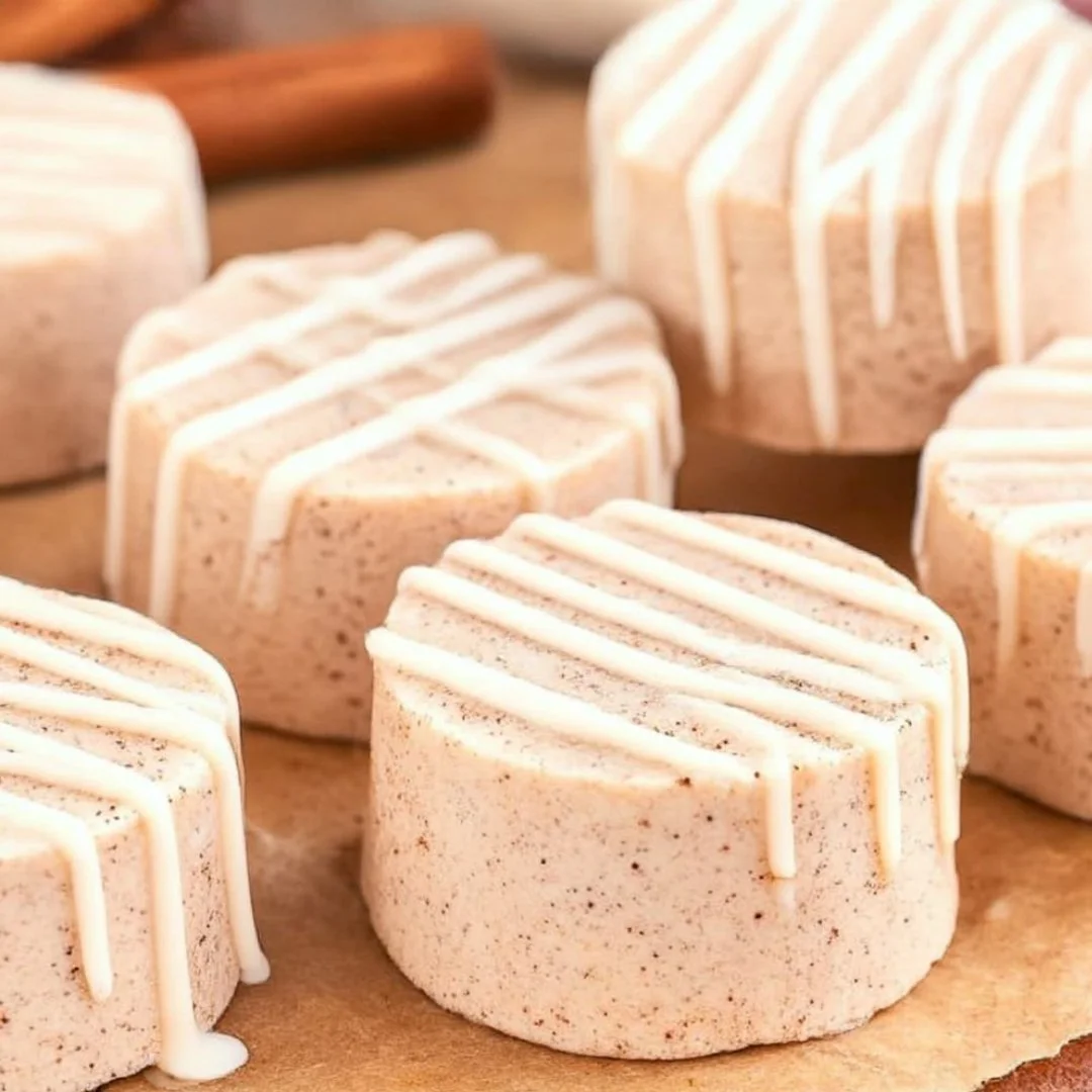 Cinnabon-style cinnamon roll fudge displayed on a wooden board