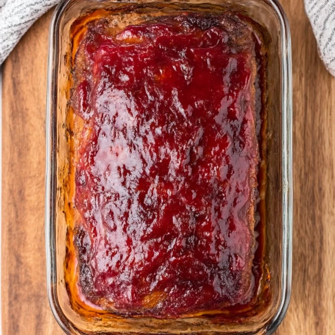 Delicious homemade meatloaf served with mashed potatoes and vegetables